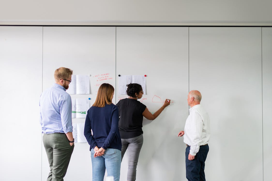 Construction scheduling experts having a meeting