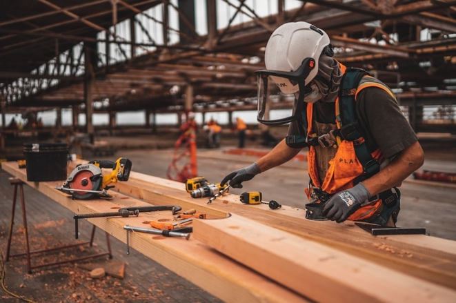 Construction worker using a power tool